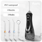Black oral irrigator with IPX7 waterproof design, featuring four nozzles and three modes for effective dental care.